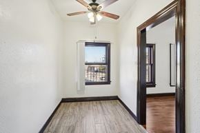 Torrance apartment for rent - A room with a ceiling fan and a window.